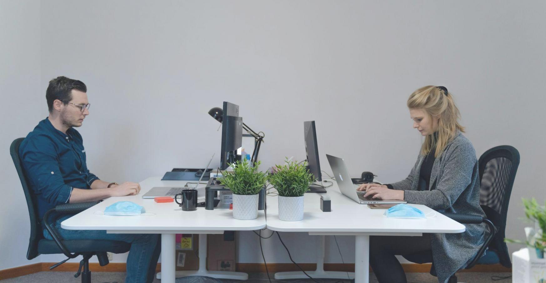 Business owner reviewing financial documents and budget planning materials